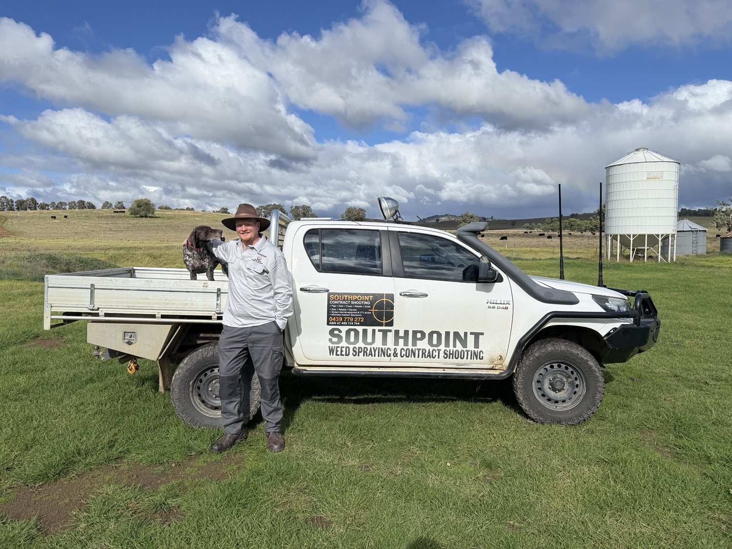 Jon South beside the SouthPoint Hilux with a working dog