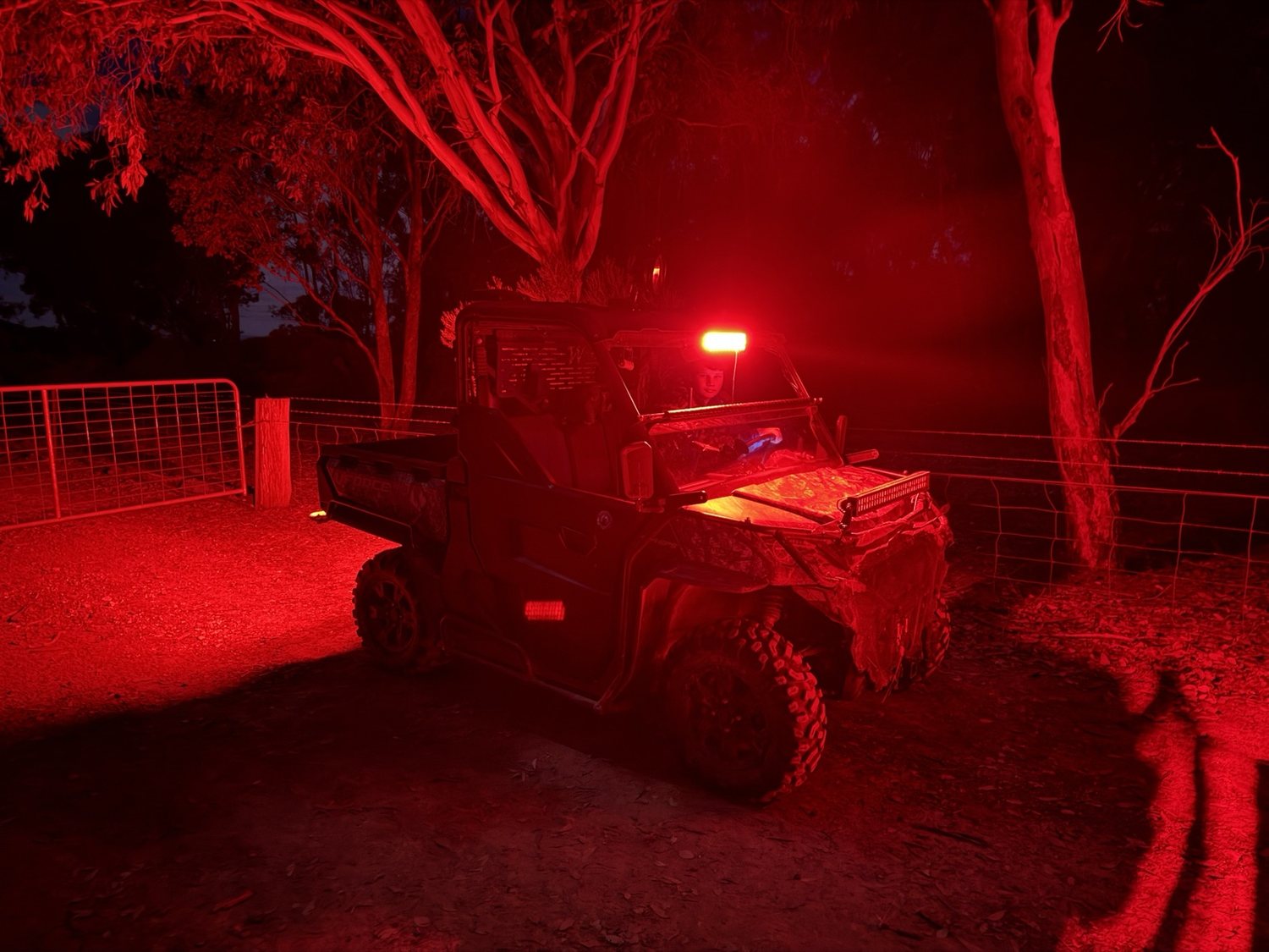 SouthPoint UTV operating under red lighting at night
